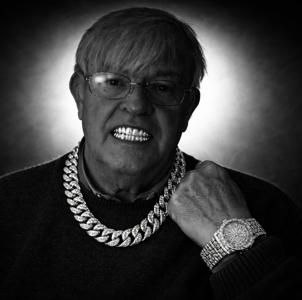 The grandpa after the win, wearing a diamond chain, diamond watch and grills